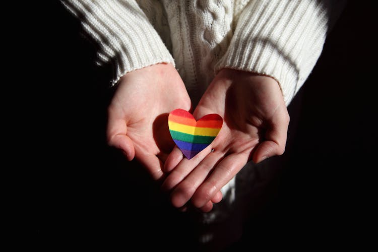 Person Holding Colorful Heart Shaped