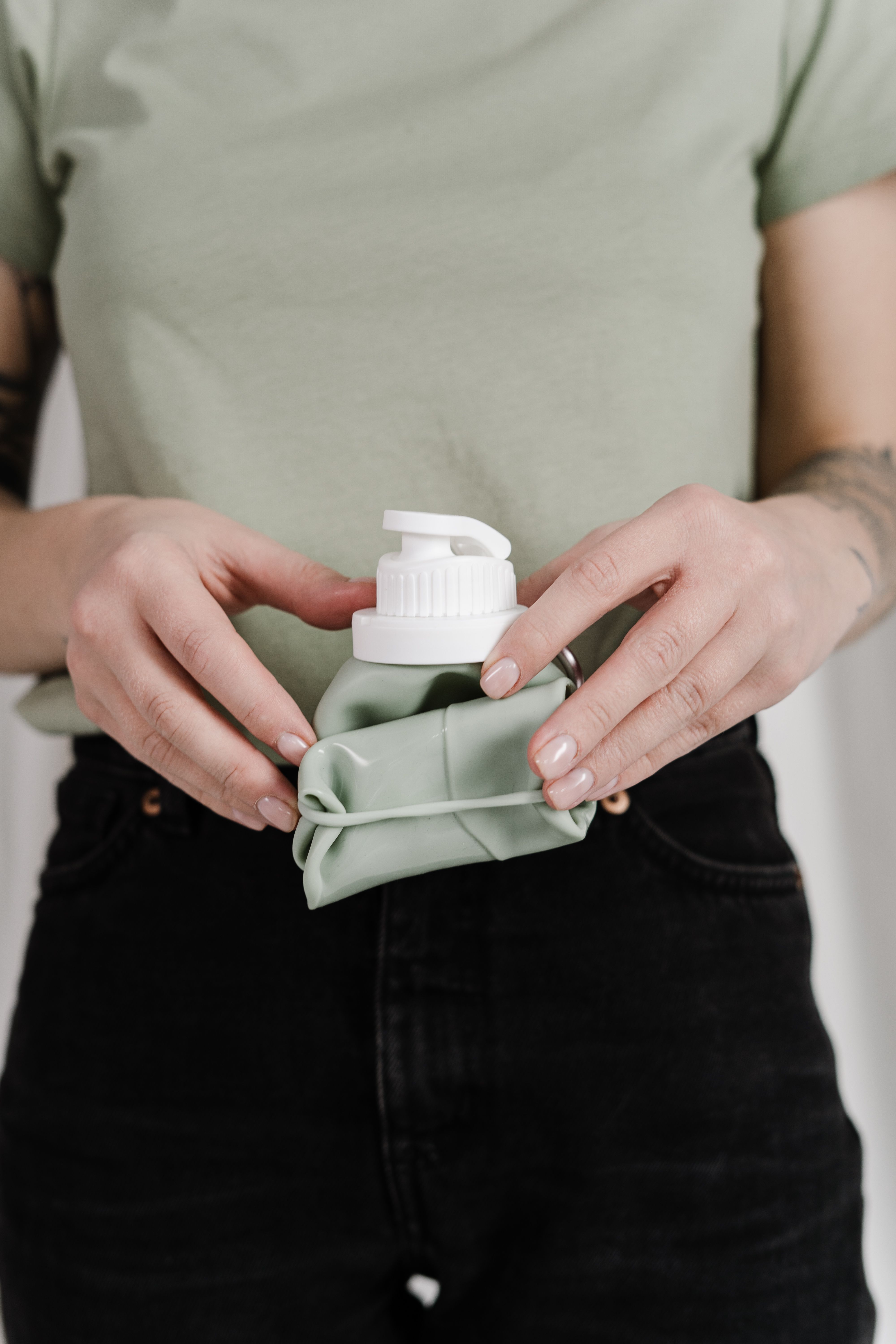 Person Holding Foldable Water Bottle · Free Stock Photo
