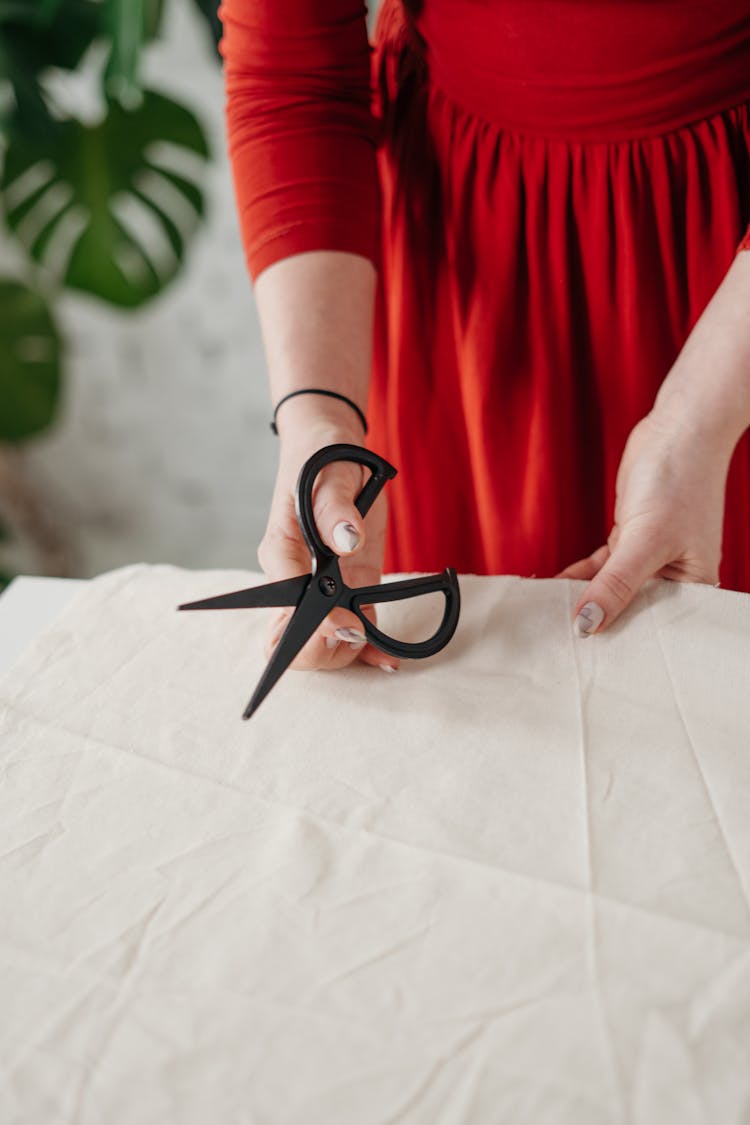 Person Holding A Scissors