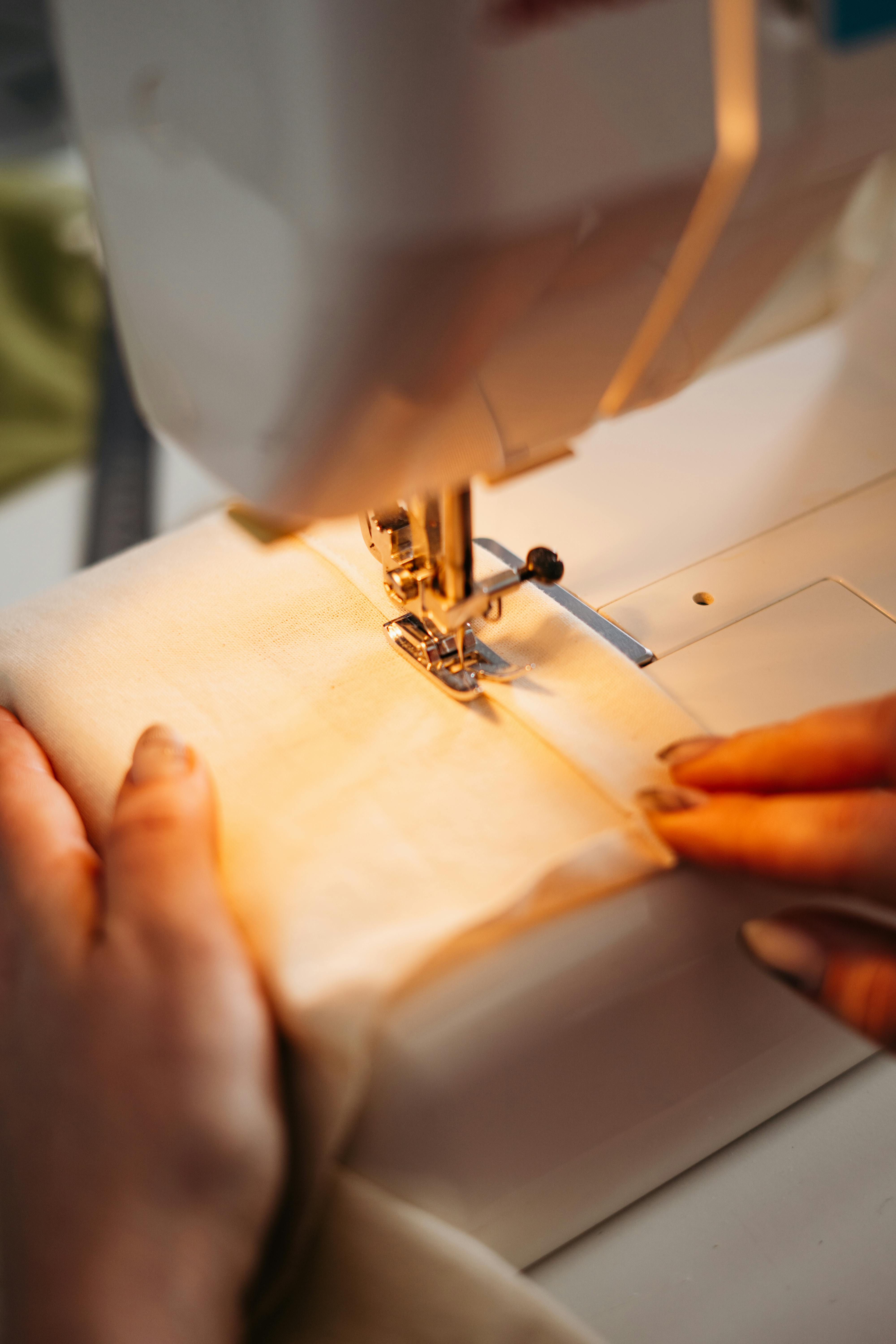 Person Sewing a Fabric · Free Stock Photo