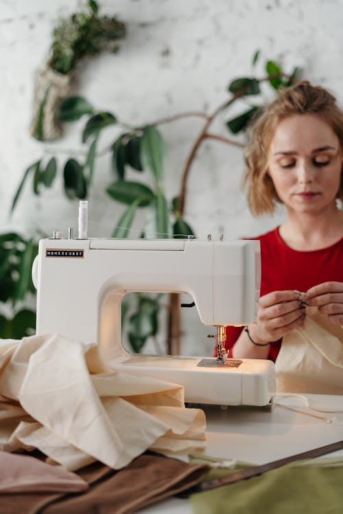 Woman in Red Shirt Sewing