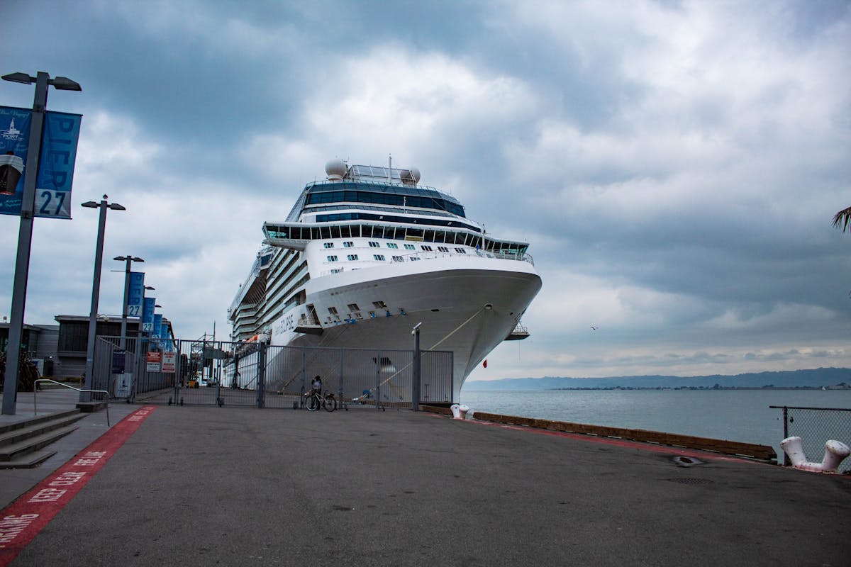 Glass meal prep containers filled with breakfast portions including oats and fruit