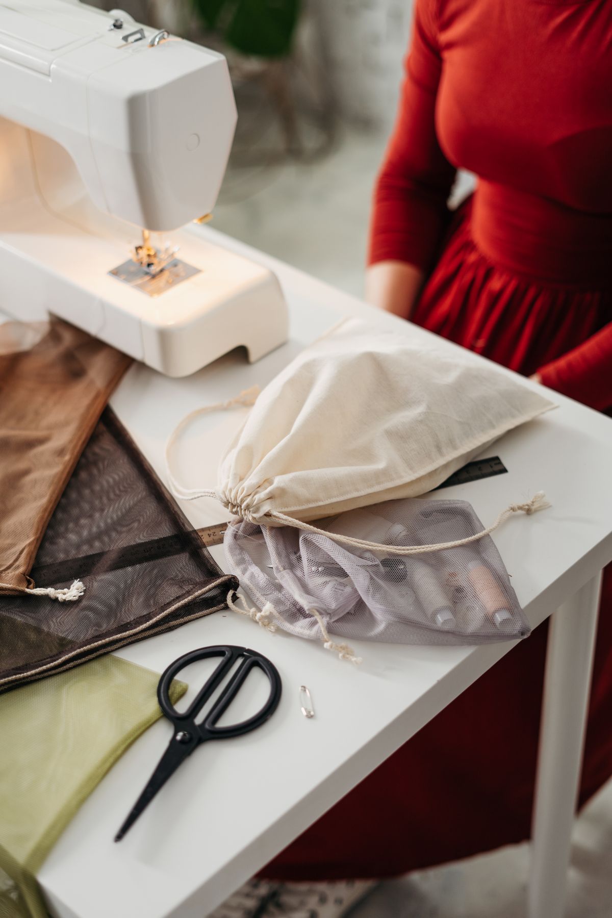 Textile accessories and threads on workbench