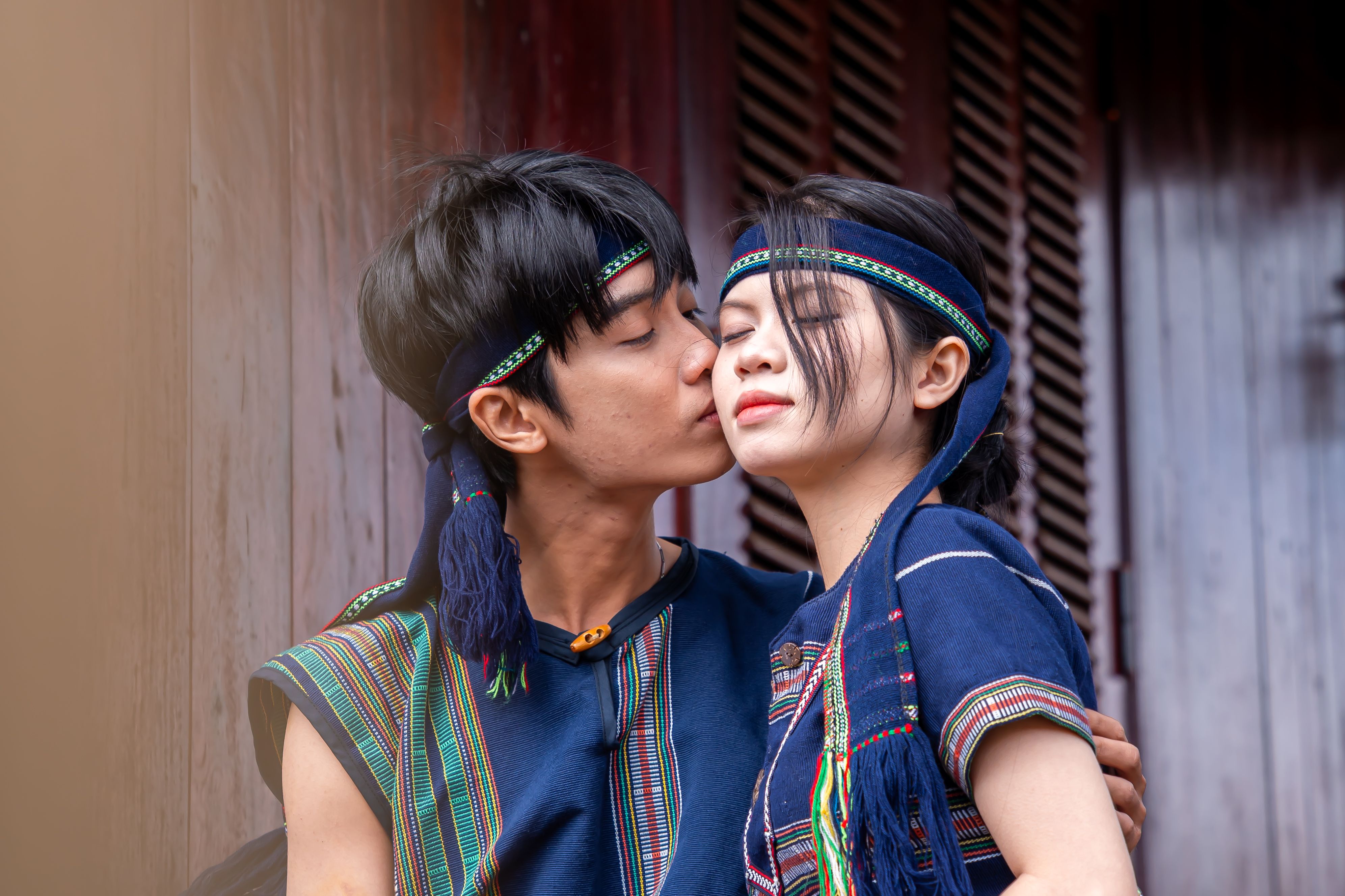Young Couple Embracing in Traditional Cultural Attire · Free Stock Photo