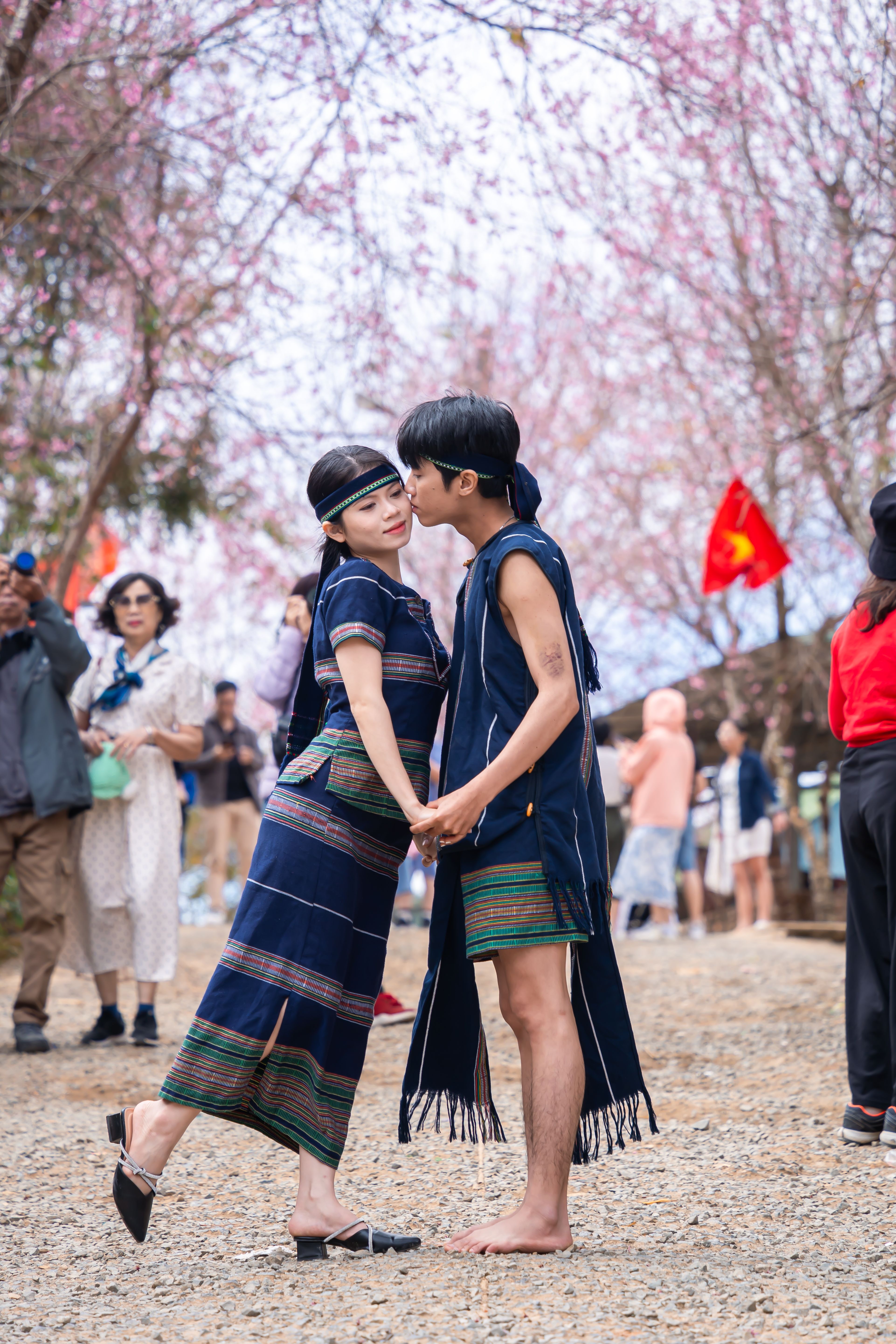 Young Couple Embracing in Traditional Cultural Attire · Free Stock Photo