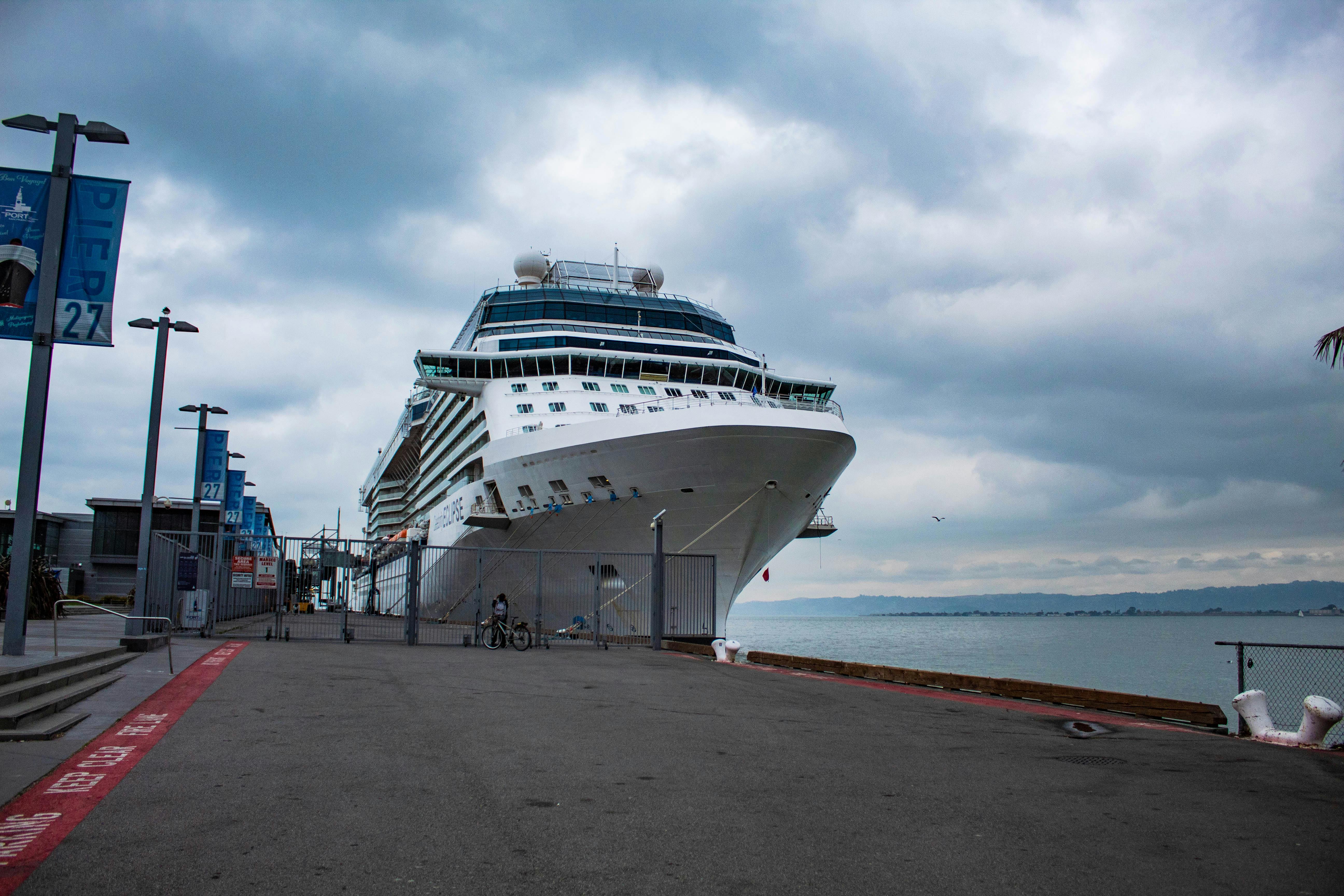 Person placing labeled containers of food into a freezer drawer