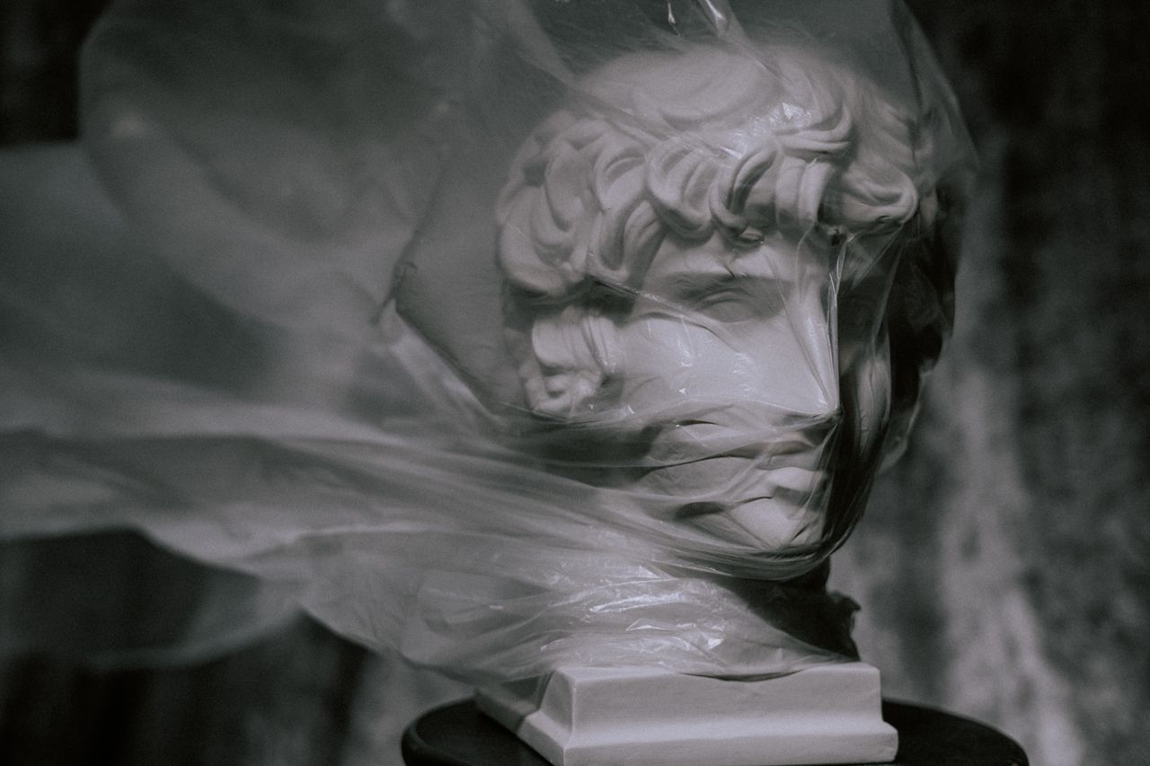 Photo of Gypsum Head deliberately Covered With Plastic Bag that's being blown by air