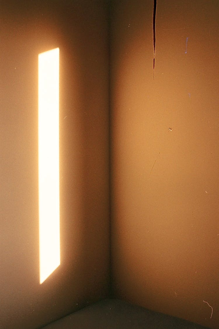 Room Interior With LED Light Illuminating Concrete Walls In Apartment