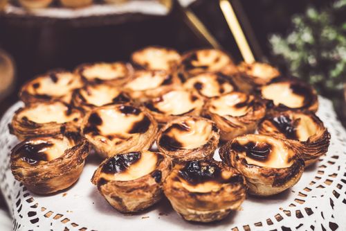 Free Close-up of savory Portuguese pastéis de nata, perfect for dessert lovers. Stock Photo