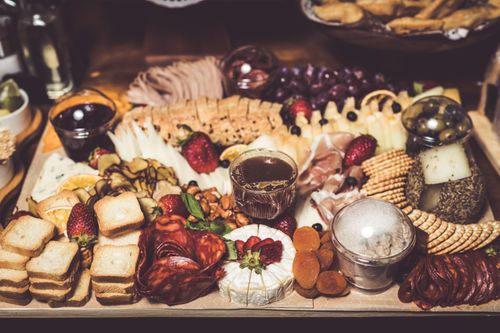 Free Savor this vibrant charcuterie board filled with meats, cheeses, fruits, and nuts, perfect for gatherings. Stock Photo