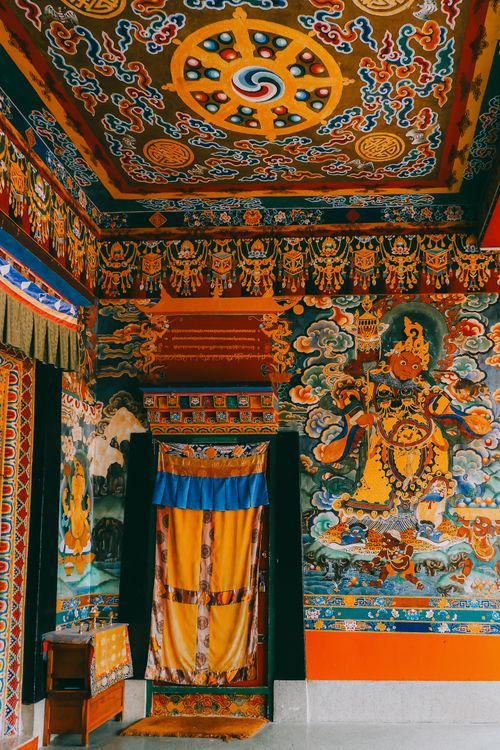 Free Colorful Buddhist monastery interior featuring intricate designs and murals in Rumtek, Sikkim, India. Stock Photo