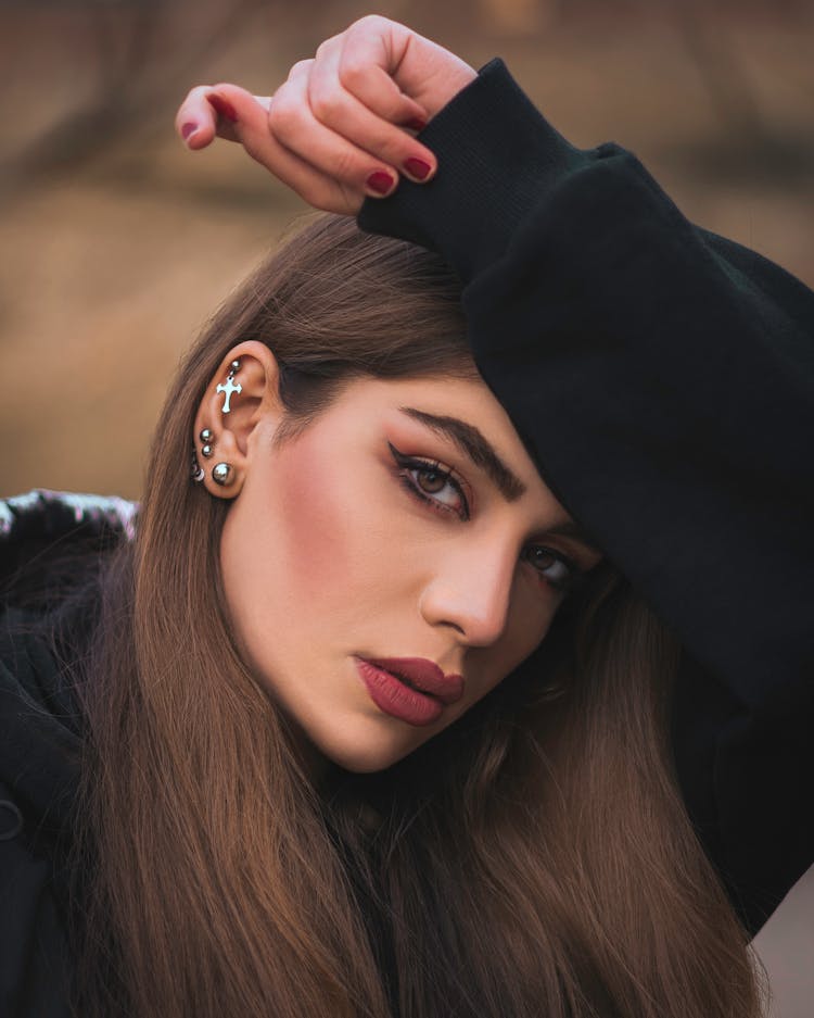 Woman In Black Hoodie Wearing Silver Ear Studs