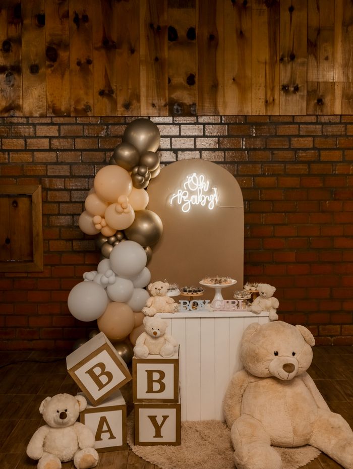 Baby shower setup with teddy bears and balloons