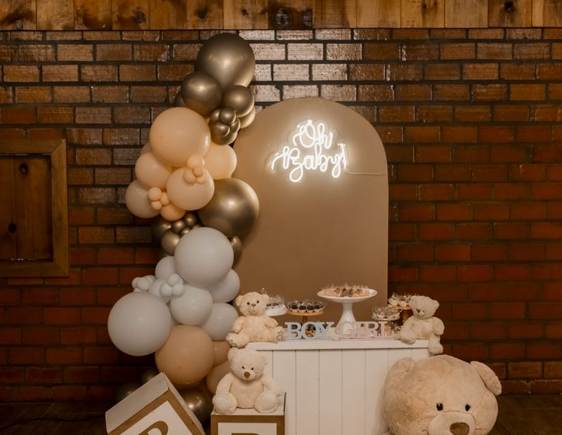 Baby shower setup with teddy bears and balloons