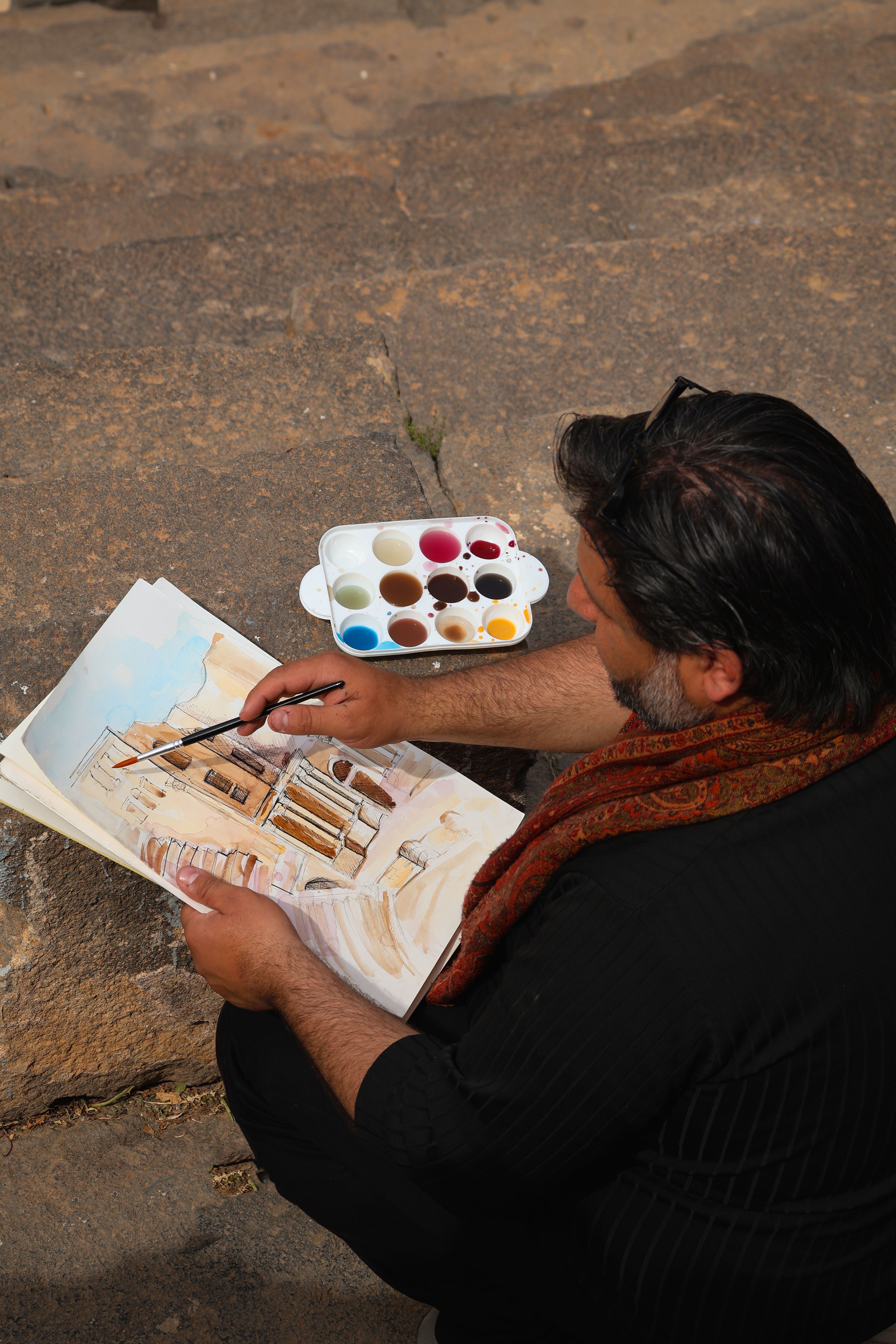 Artist Sketching Syrian Architecture Outdoors · Free Stock Photo