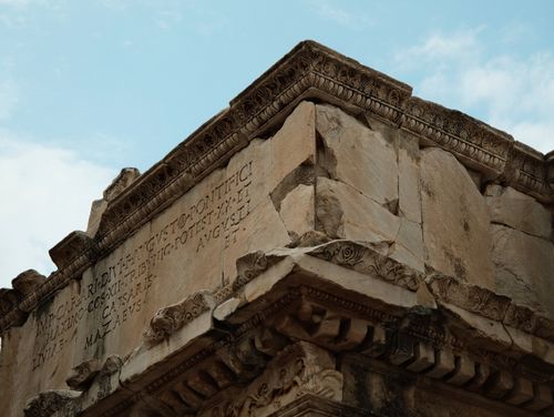 Free Close-up view of ancient Roman architectural details showing inscriptions and intricate carvings. Stock Photo
