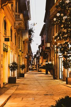 A picturesque evening view of a historic Milan street adorned with architectural beauty.