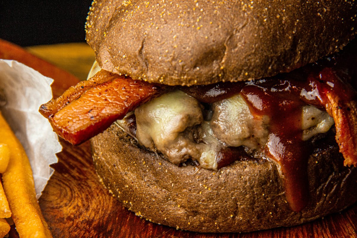 Assorted nuts, seeds, and leafy greens arranged in bowls