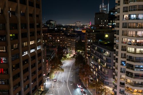 Free View of Sydney's bustling city streets at night, showcasing vibrant lights and urban architecture. Stock Photo