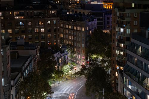 Free Captured Griffiths Teas Building and city lights illuminating a quiet night in downtown Sydney, Australia. Stock Photo