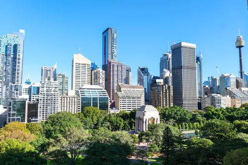 Free Panoramic view of Sydney's skyline featuring Hyde Park and the iconic War Memorial. Stock Photo