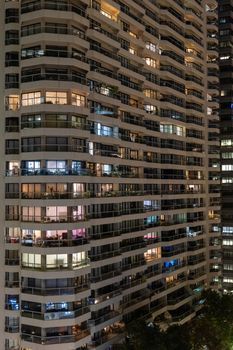 A lively night scene of modern high-rise residential buildings in Sydney, Australia.