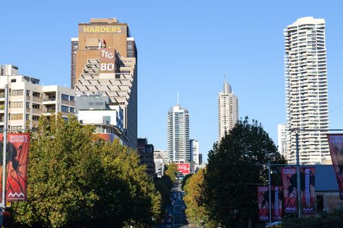Free View of downtown Sydney with skyscrapers, trees, and clear blue skies. Stock Photo
