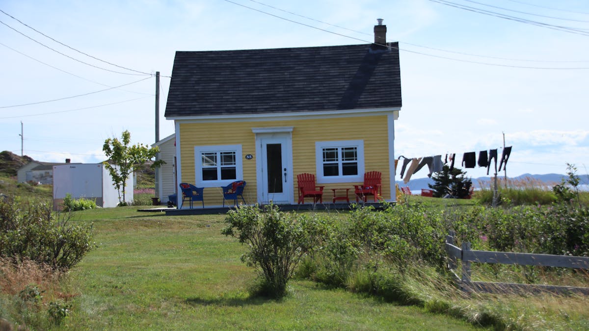 Person relaxing on a sofa with smartphone placed aside