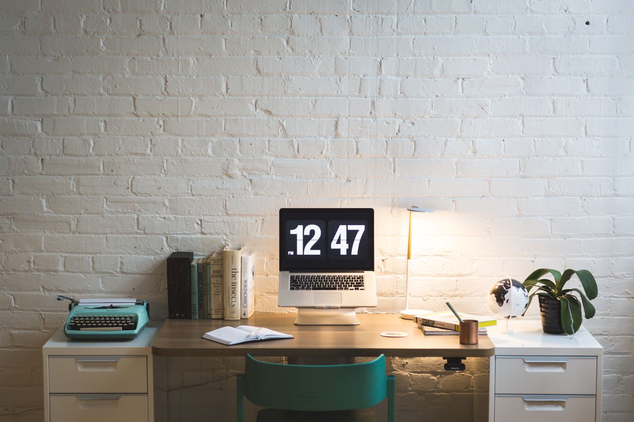 elegant workspace featuring a computer on a sleek desk ideal for work