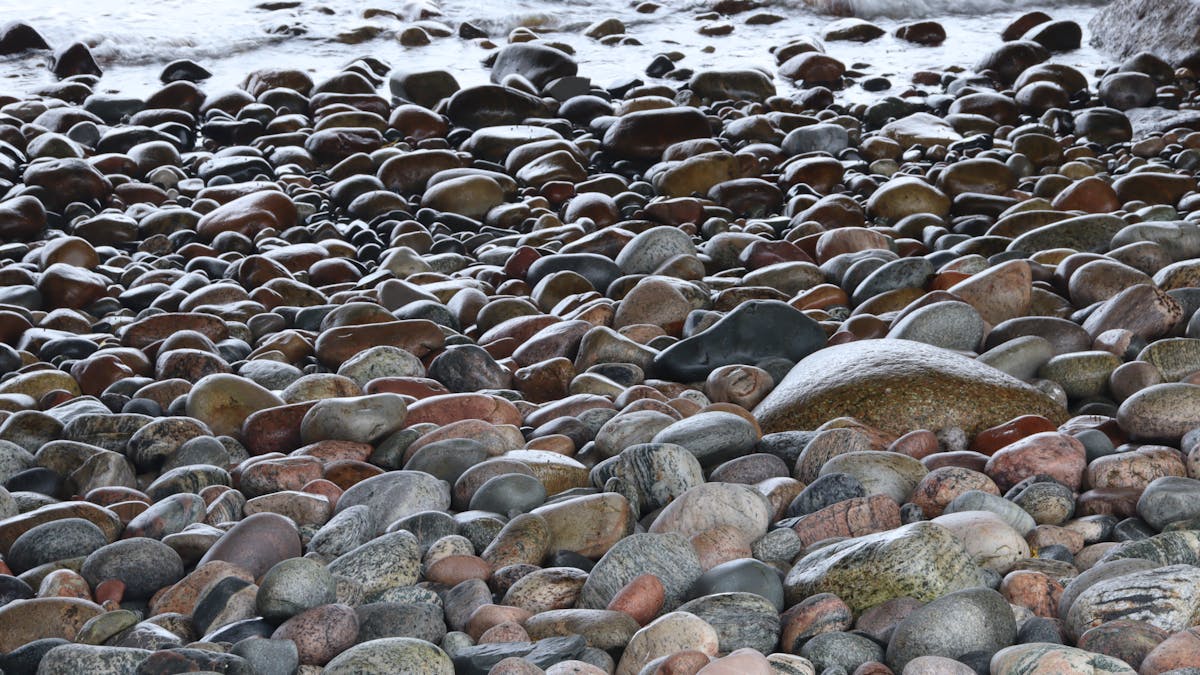 Finished layered green and white parfait topped with fresh fruit and seeds