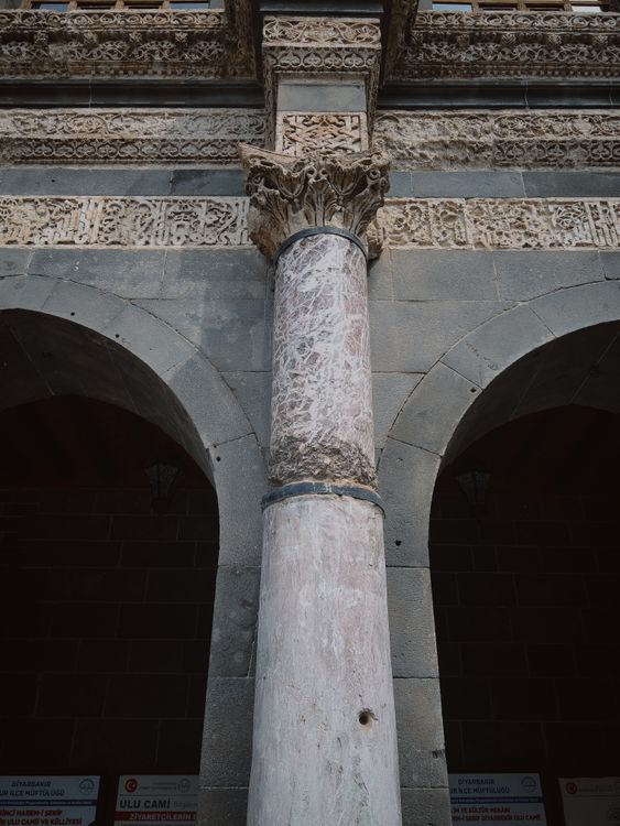 Detailed Stone Architecture with Arch and Column · Free Stock Photo