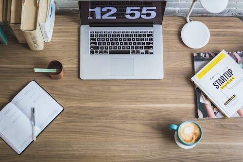 Free Black and Silver Laptop Computer Beside Blue Ceramic Mug Stock Photo