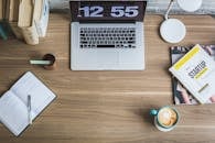 Black and Silver Laptop Computer Beside Blue Ceramic Mug