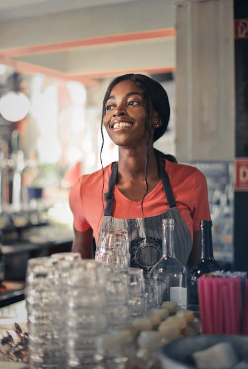 Woman in Orange T-Shirt Smiling