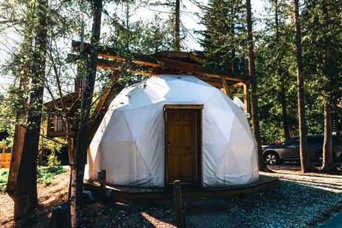 Free Explore the charm of a geodesic dome nestled in the peaceful forest of Revelstoke, BC, Canada. Stock Photo