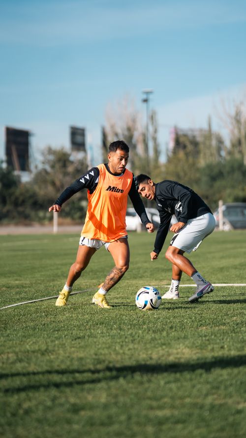 Free Two soccer players showcasing skills during an outdoor practice session on a sunny day. Stock Photo