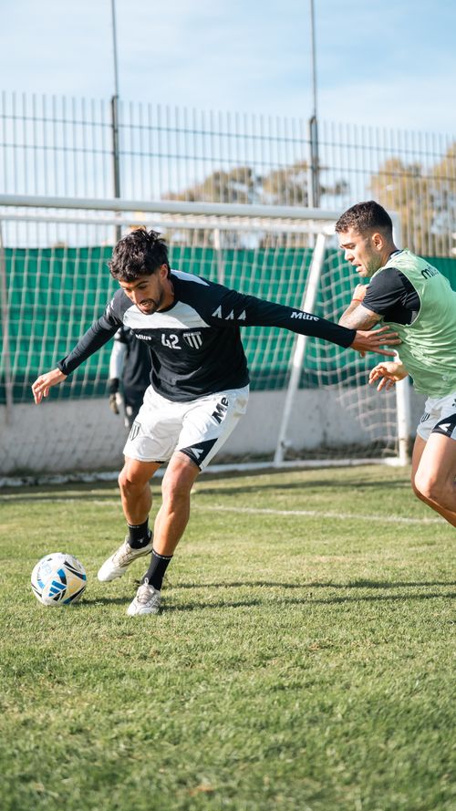 Free Two soccer players in action during an outdoor training session on a sunny day. Stock Photo