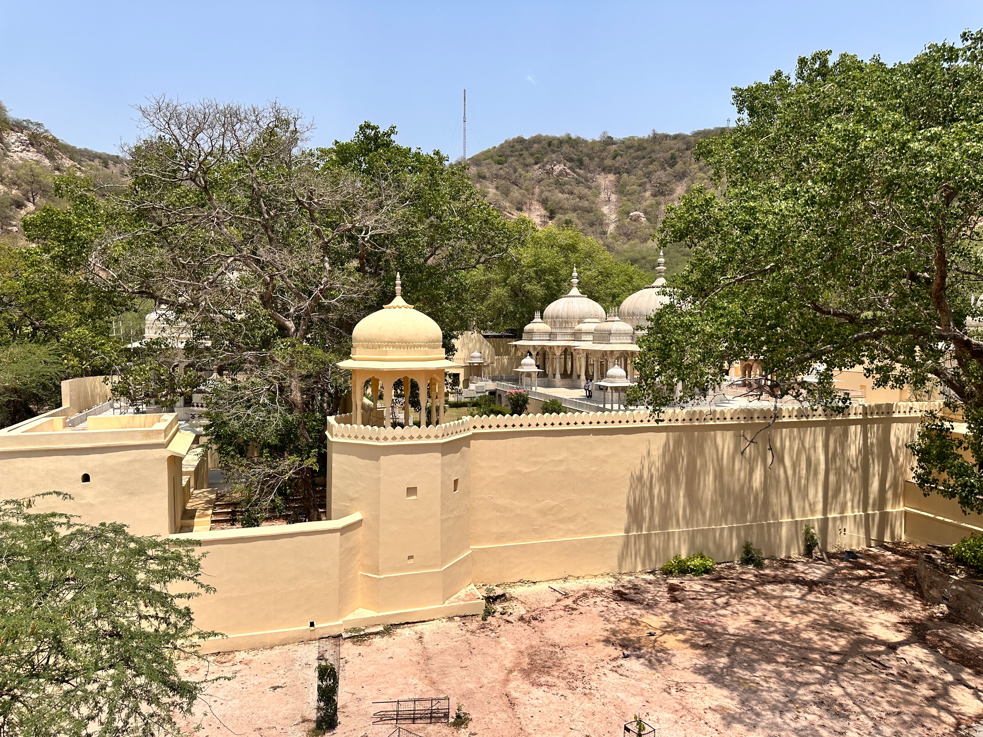 Aerial view of the iconic Panna Meena Ka Kund with traditional architecture and lush greenery in Jaipur, Rajasthan.