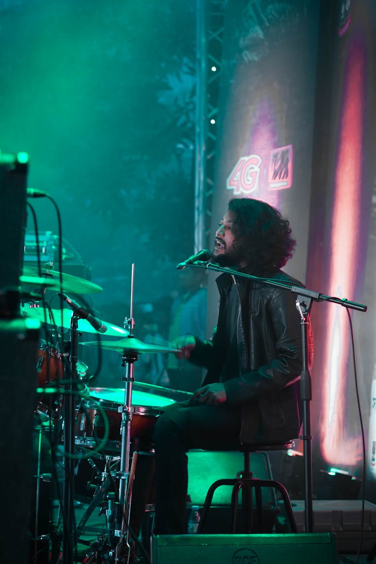 Man In Black Jacket Singing On Stage