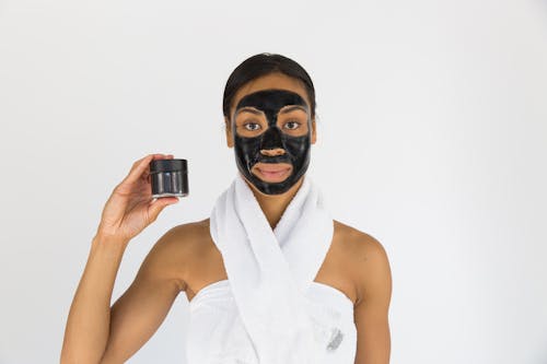 Free Woman Holding Black Mask Stock Photo