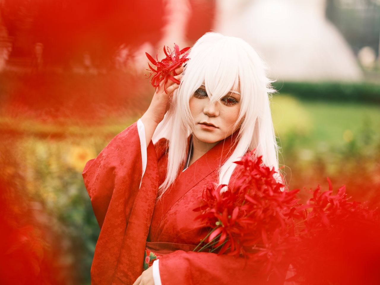 captivating anime inspired cosplay amidst vibrant red flowers in a vie