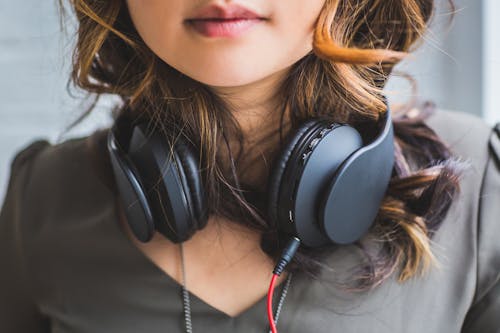 2700: Free Woman Wearing Headset on Neck Stock Photo