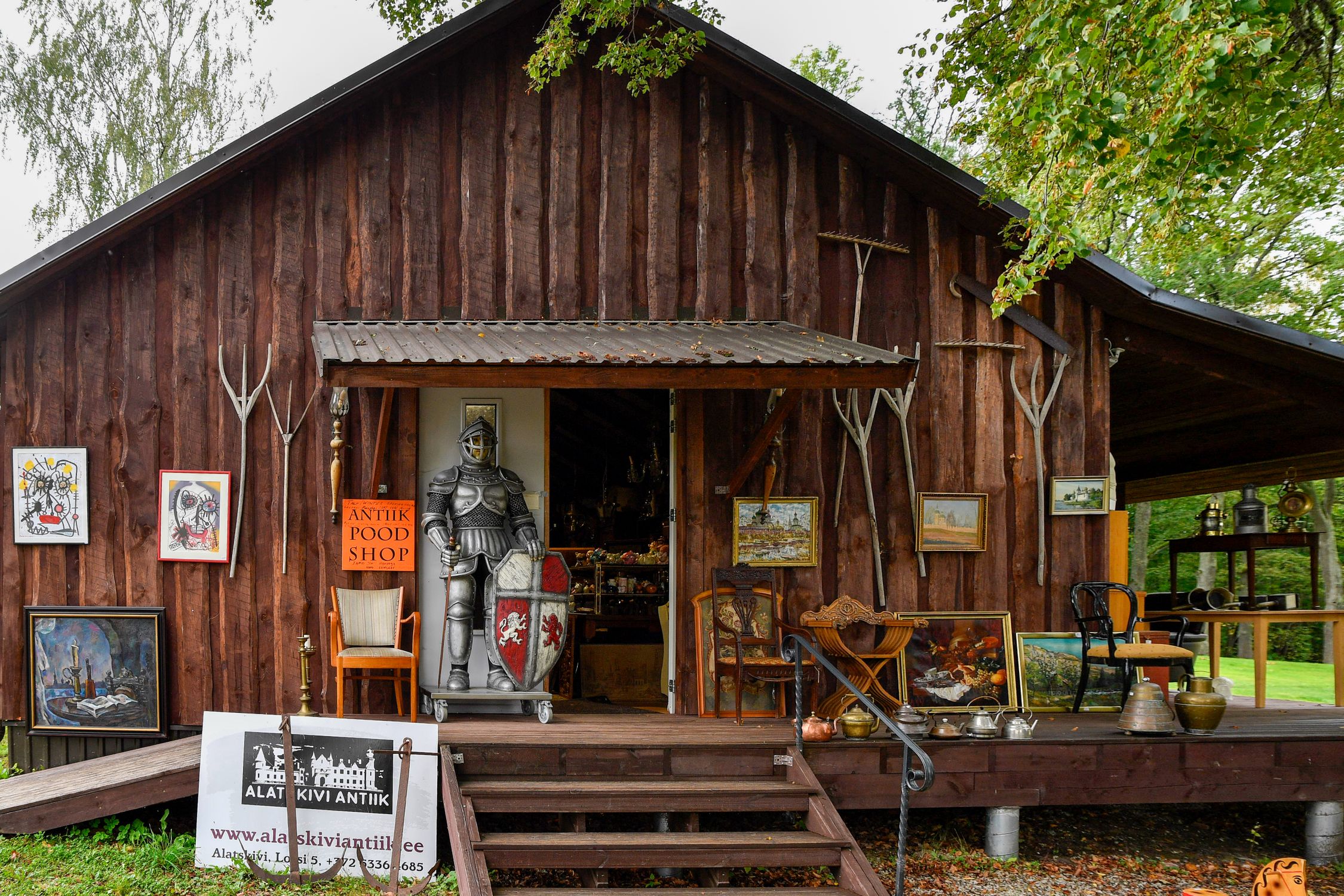 Charming rustic antique shop in Alatskivi, Estonia featuring medieval and vintage collectibles.