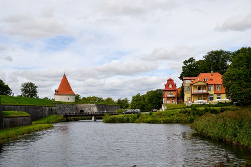 Free Scenic view of Kuressaare Castle and park reflecting in the moat, Saaremaa, Estonia. Stock Photo