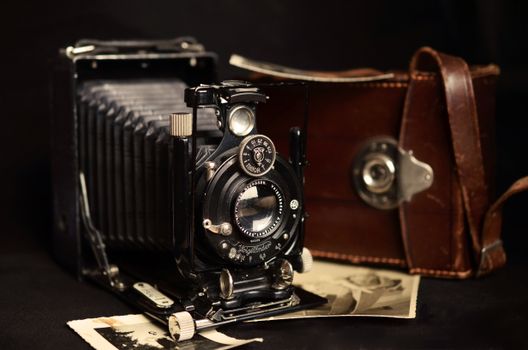 Close-up of an antique Voigtlander camera with a leather case, showcasing vintage photography equipment.