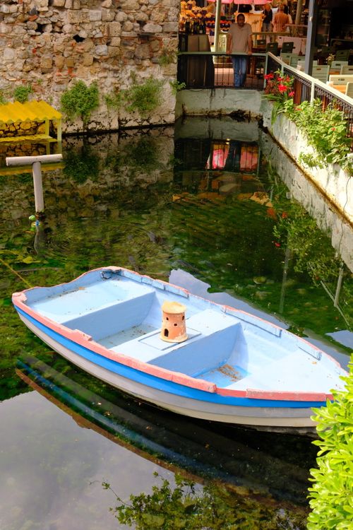 Pink Rowboat Colorful Rowboat in Scenic Outdoor Canal Scene · Free Stock Photo