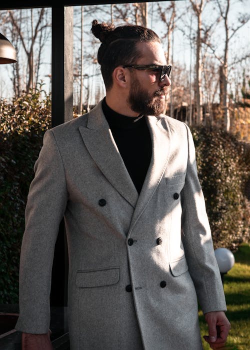 Man in Brown Suit Jacket Standing Near Green Trees