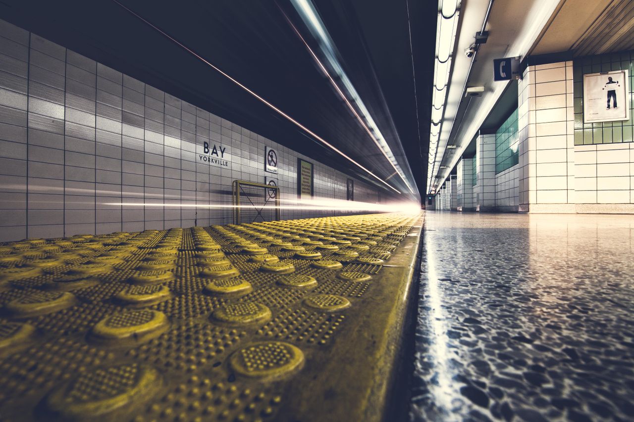 low angle view of a fast moving train at bay yorkville subway station