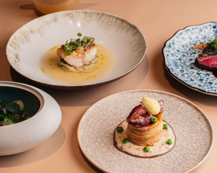 A selection of artistic fine dining dishes at an upscale restaurant in Tokyo, Japan.
