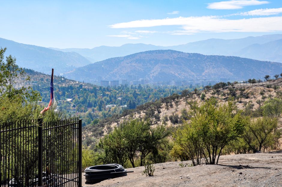 Scenic view of Santiago's nature with mountains and greenery under a bright sky.
